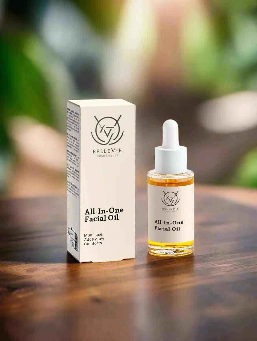 Natural Face Oils – Botanical, Vegan & Organic | BelleVie: clear All-In-One Facial Oil dropper bottle with golden oil and cream box
