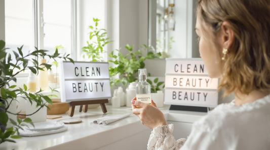 Woman checks clean beauty product label in sunny modern bathroom