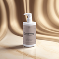 Keratin Volume Boost Shampoo bottle on a beige background