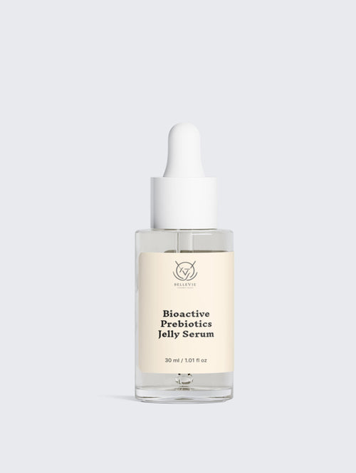 Skincare serum bottle with dropper on a light gray background
