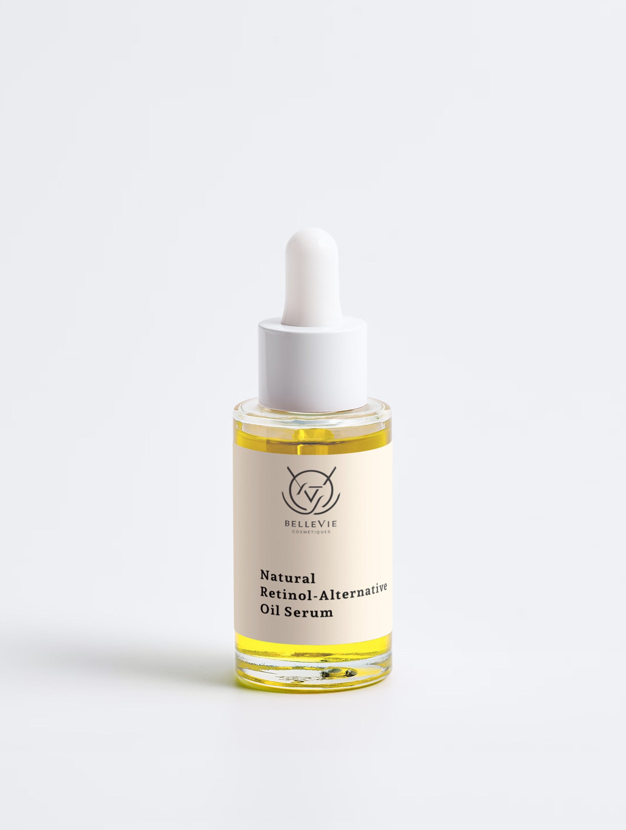 A small glass dropper bottle of Bellevie Alternative Oil Serum with pale yellow oil, set against a seamless light gray background.