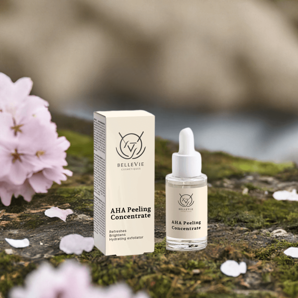 Bellevie AHA Peeling Concentrate 30ml bottle and box on a natural background with flowers.