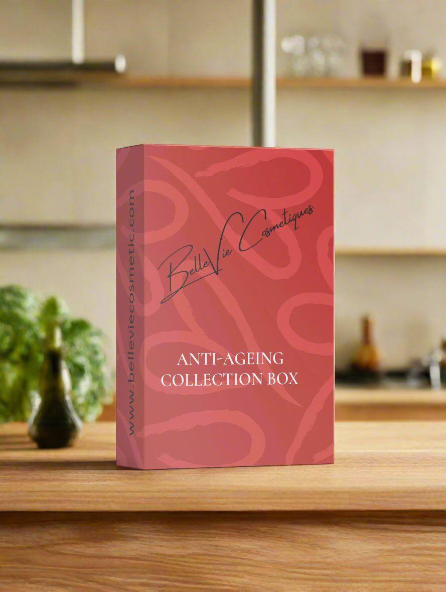 A collection box labeled 'Anti-Ageing Collection Box g' on a wooden surface, with a signature at the bottom, indicating it might be a branded product.
