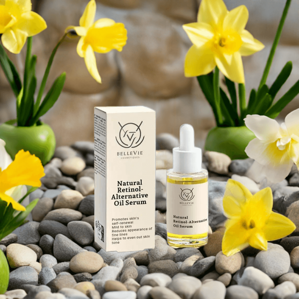 Bellevie Natural Retinol-Alternative Oil Serum 30ml with packaging on pebbles and background of flowers