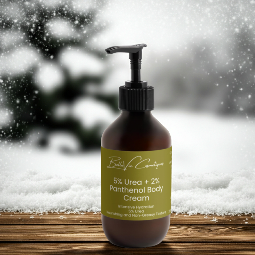 Bottle of Bella Vie Cosmetics 5% Urea + 2% Panthenol Body Cream with a snowy background