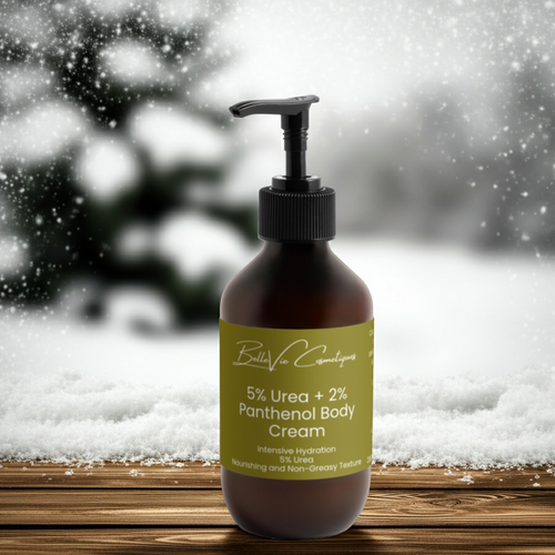 Bottle of Bella Vie Cosmetics 5% Urea + 2% Panthenol Body Cream with a snowy background