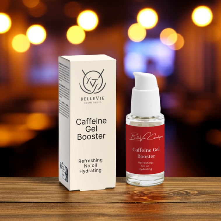 BelleVie Caffeine Gel Booster 30ml and packaging on a wooden surface with blurred warm background lights.