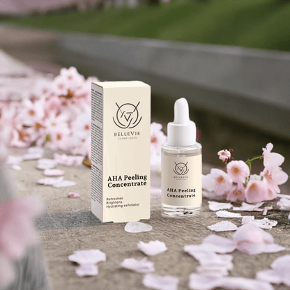 Exfoliating AHA concentrate bottle on clean minimal background