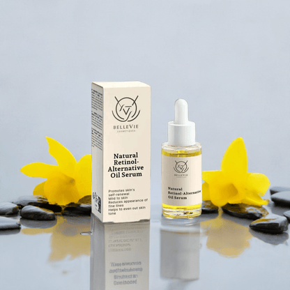 Bellevie Natural Retinol Alternative Oil Serum with packaging on a reflective surface with stones and flowers.