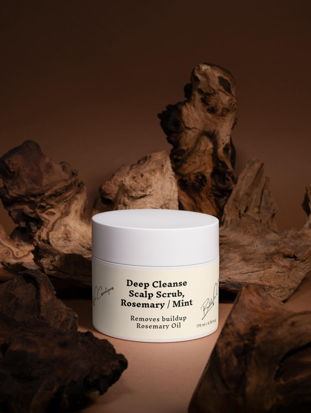 Jar of Deep Cleanse Scalp Scrub with Rosemary and Mint on a brown background