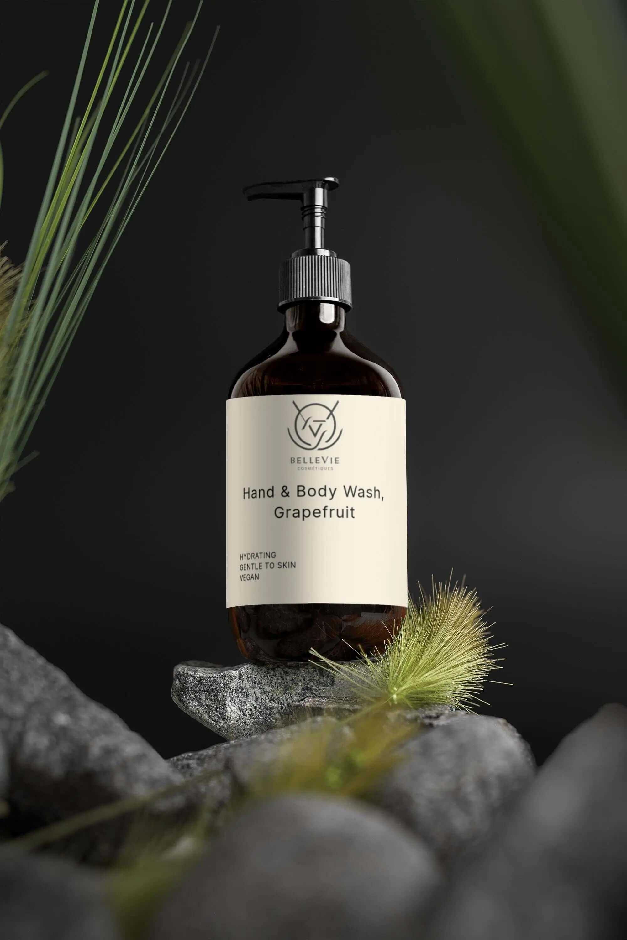Hand and body wash bottle labeled 'Gilevye' on a dark background with plants.