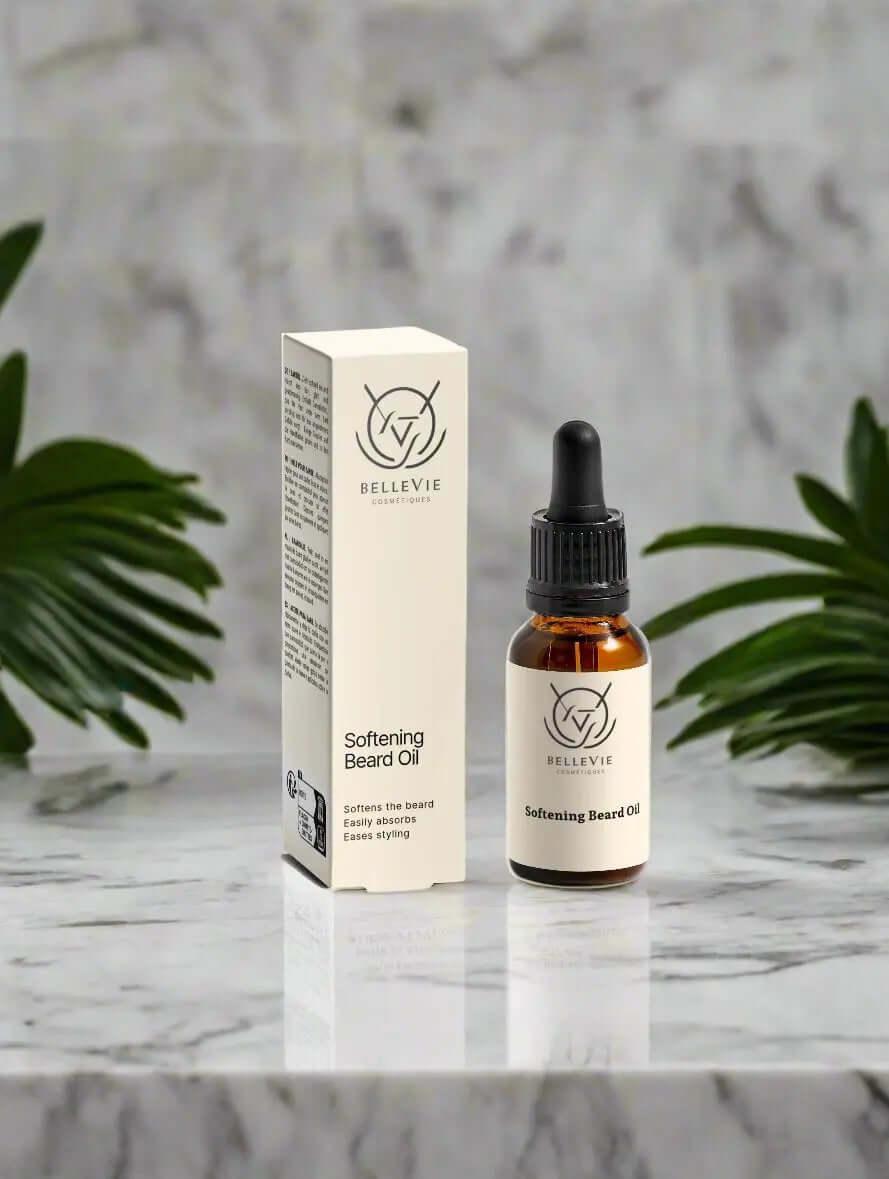 Softening Beard Oil 20ml box and bottle kept on marble with the background of leaves