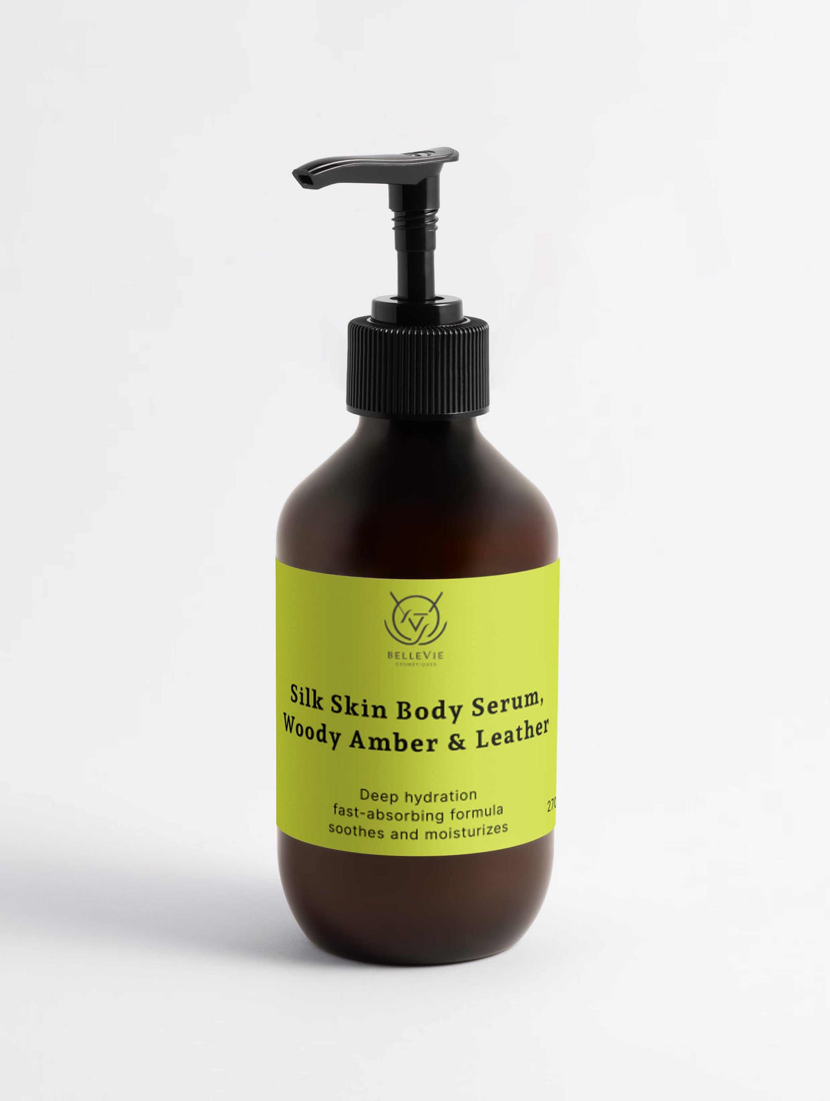 Silk Skin Body Serum in a dark amber bottle with a bright lime-green label and black pump dispenser, featuring Woody Amber & Leather scent.