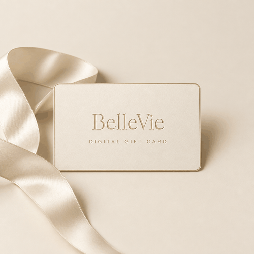 BelleVie Digital Gift Card shown as a cream card with gold lettering and a subtle gold border, beside a satin ribbon