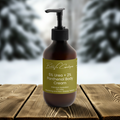 Bottle of Bella Vie Cosmetics 5% Urea + 2% Panthenol Body Cream 280ml on a wooden surface with blurred natural background
