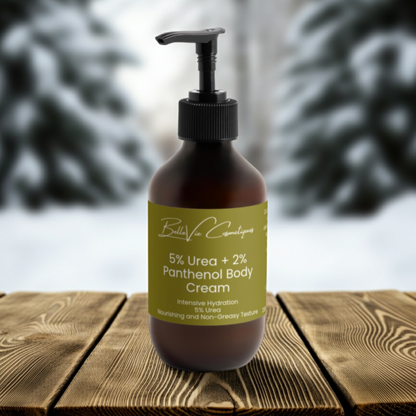 Bottle of Bella Vie Cosmetics 5% Urea + 2% Panthenol Body Cream 280ml on a wooden surface with blurred natural background