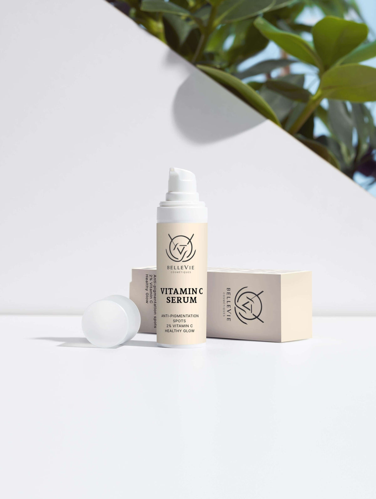 Dark Spot Routine Duo featuring a white Vitamin C serum pump bottle with beige label beside its matching cream box
