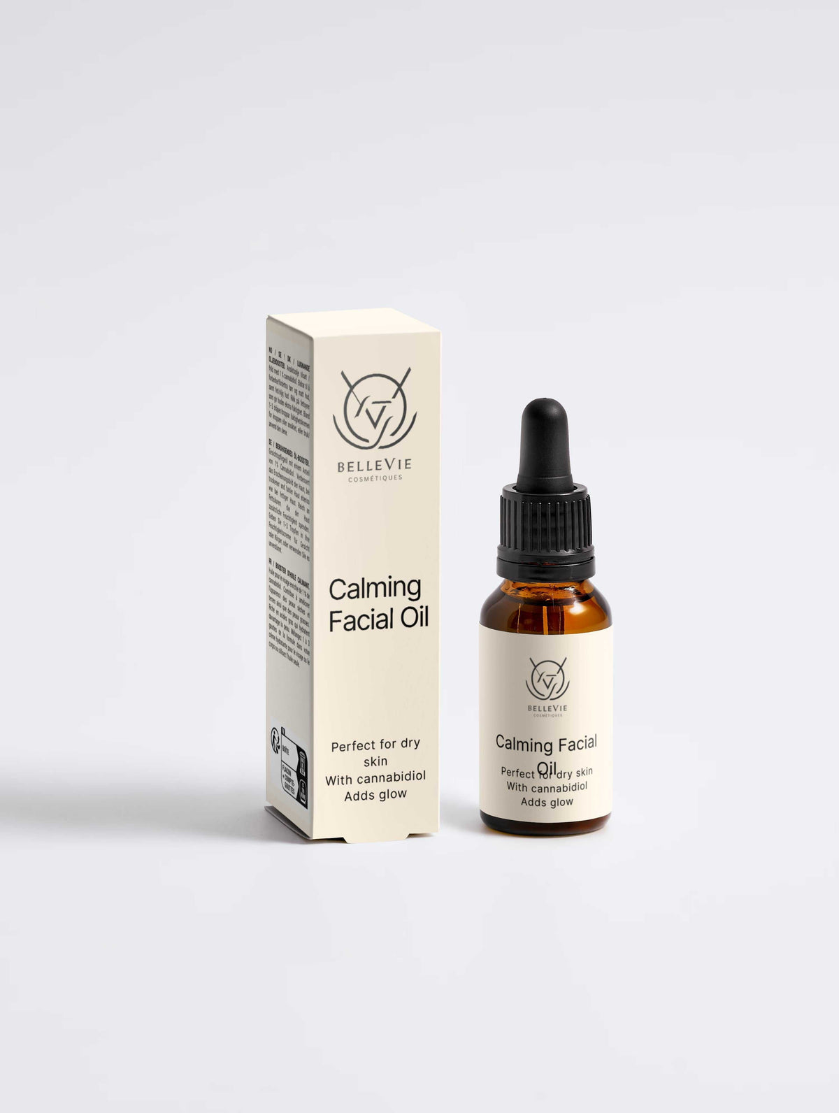 Calming Facial Oil in an amber glass dropper bottle with a black pipette and cream BelleVie box packaging.