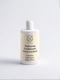 Fresh Conditioner in a cream and white bottle with a pump, labeled Hydrating Conditioner Citrus Cocktail.