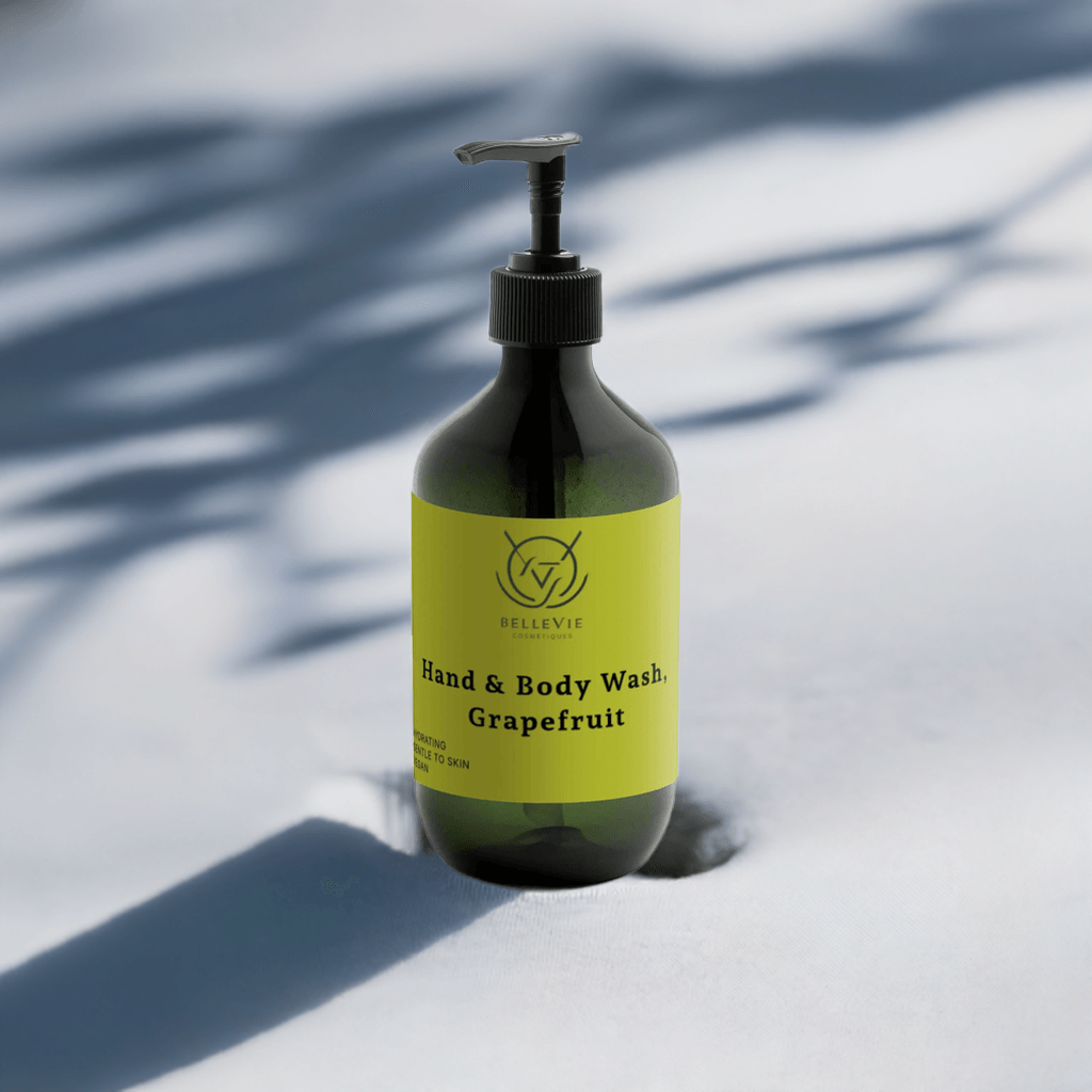 Eco-friendly Grapefruit Body Wash product placed with fresh grapefruit slices