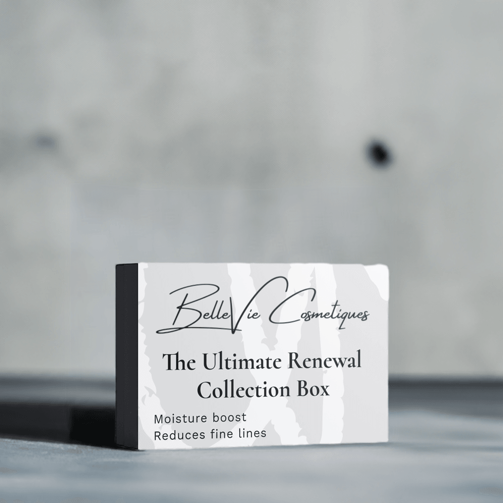 Ultimate Renewal Collection Box skincare set in white and black packaging, featuring subtle marbled patterns and a slim dark side panel.