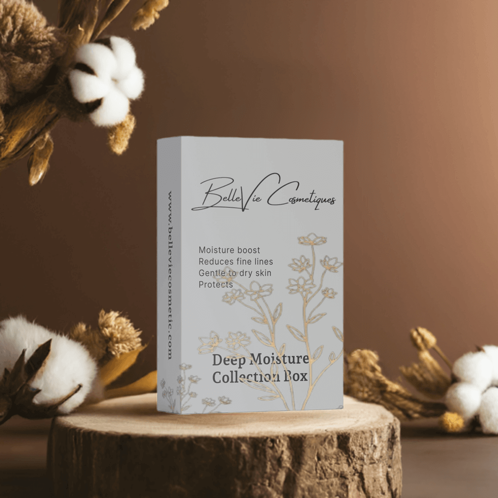 Deep Moisture Collection Box skincare set in a pale gray carton with gold botanical line art and script branding