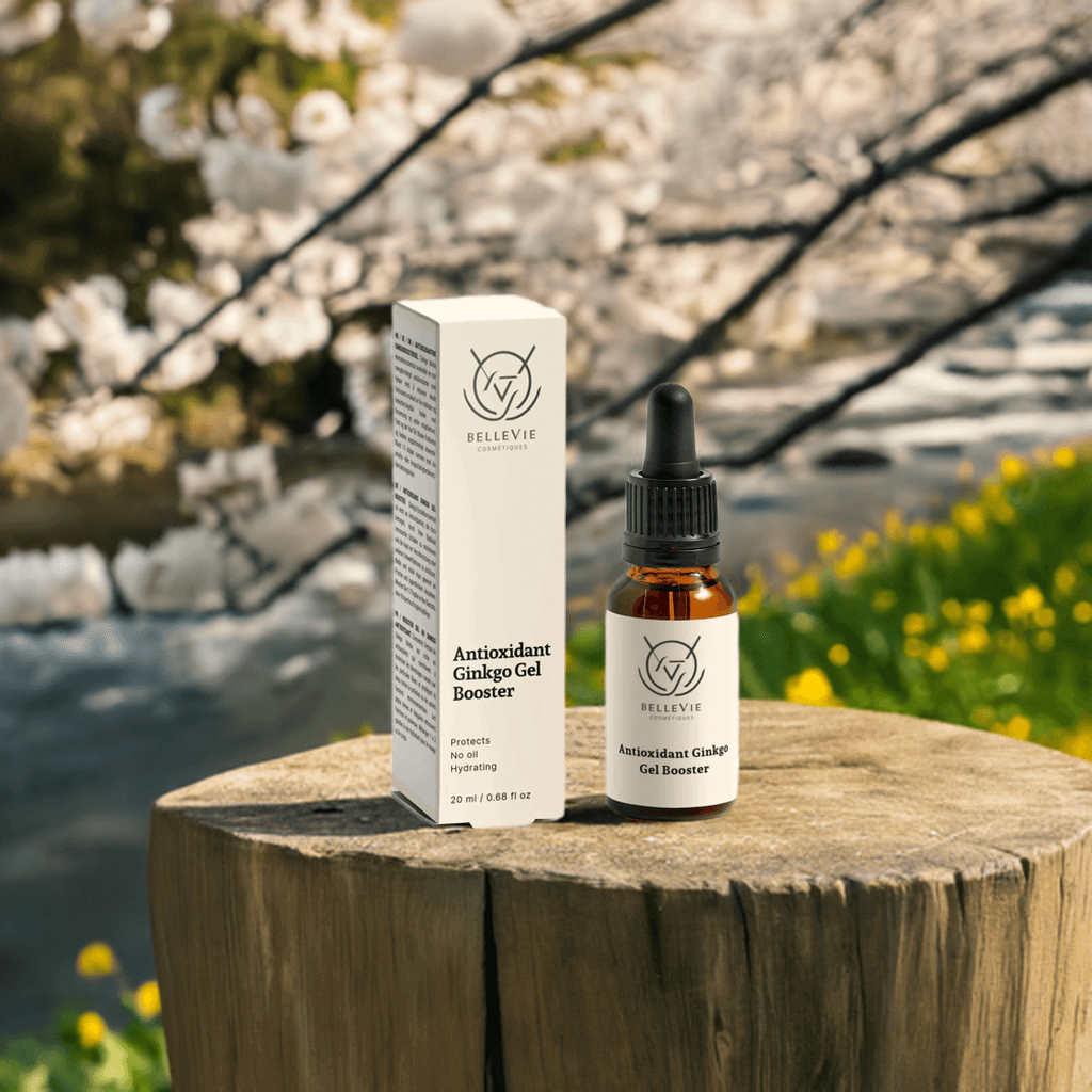 Bellevie Antioxidant Ginkgo Gel Booster bottle and box on a wooden stump with cherry blossoms in the background