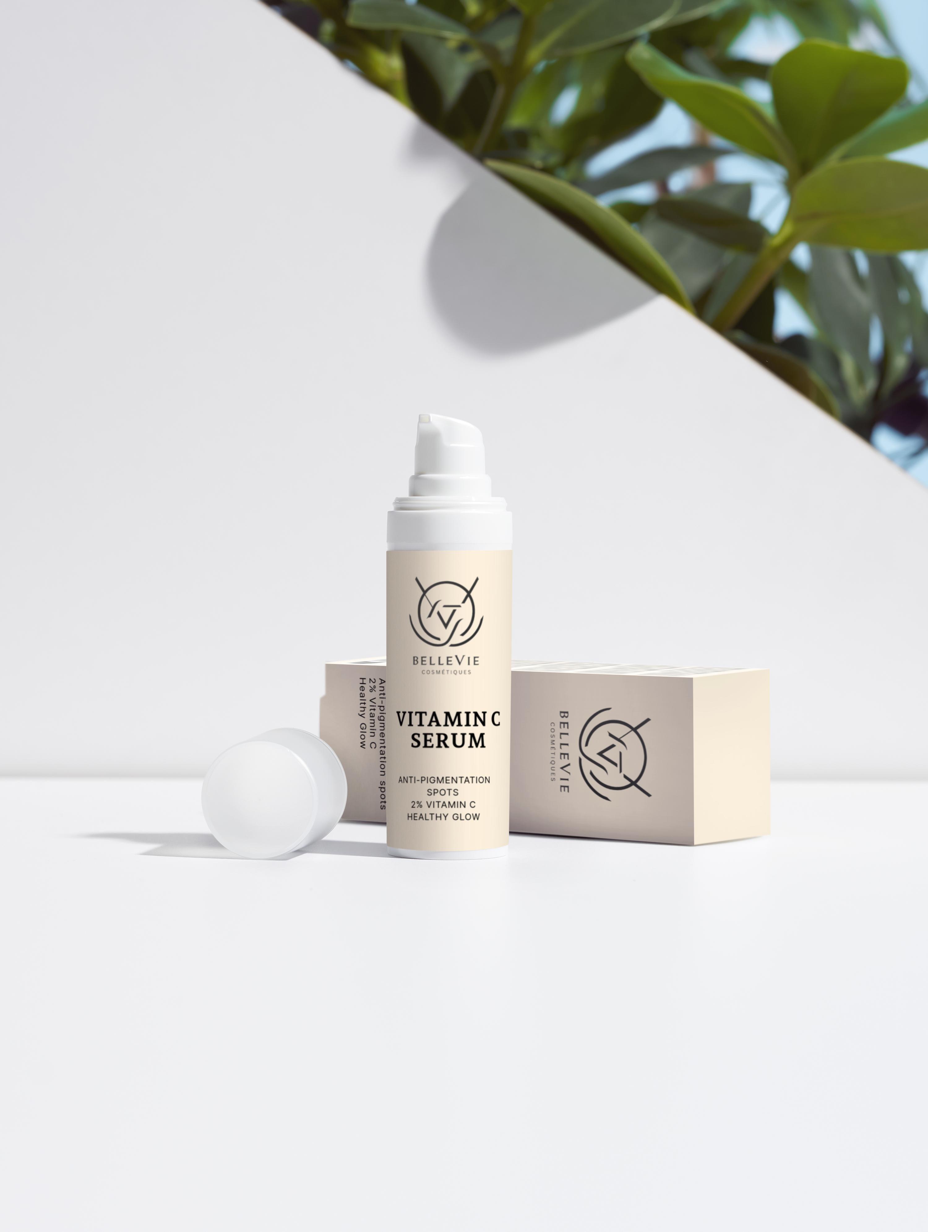 Vitamin C Serum For Face 30ml - bottle and box on a table with background of leaves
