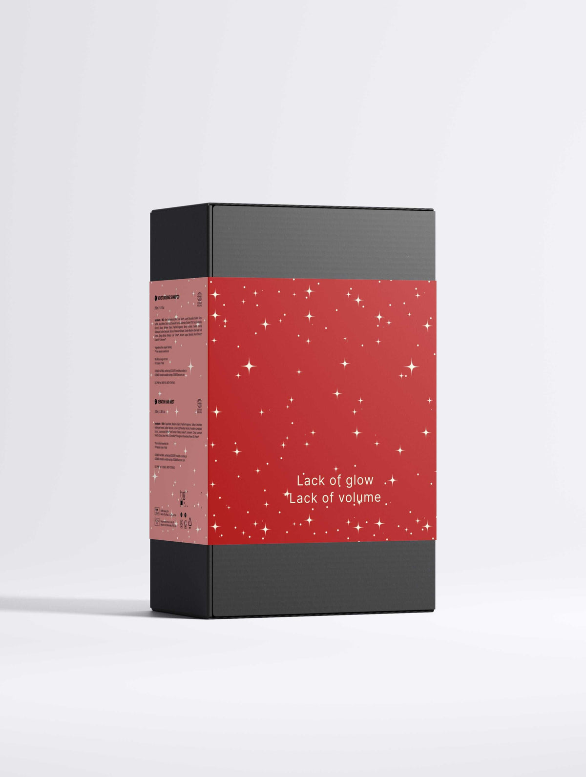 Hair Revival Bundle gift box with a red star-speckled band, black panels and “Lack of glow, Lack of volume” text