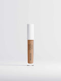 Hydrating Correcting Concealer in a warm medium beige shade, shown in a slim clear tube with a white cap