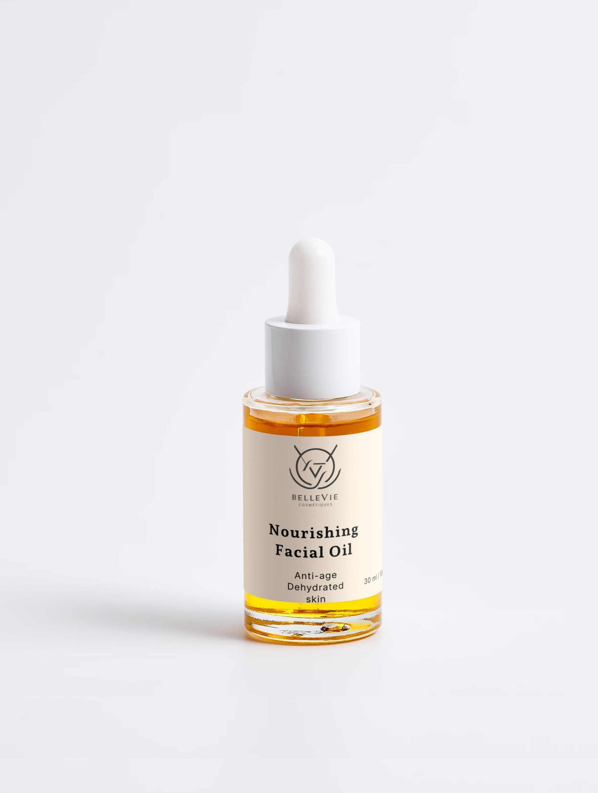 Nourishing Facial Oil 30ml in a clear glass dropper bottle with golden oil, white cap and minimalist label