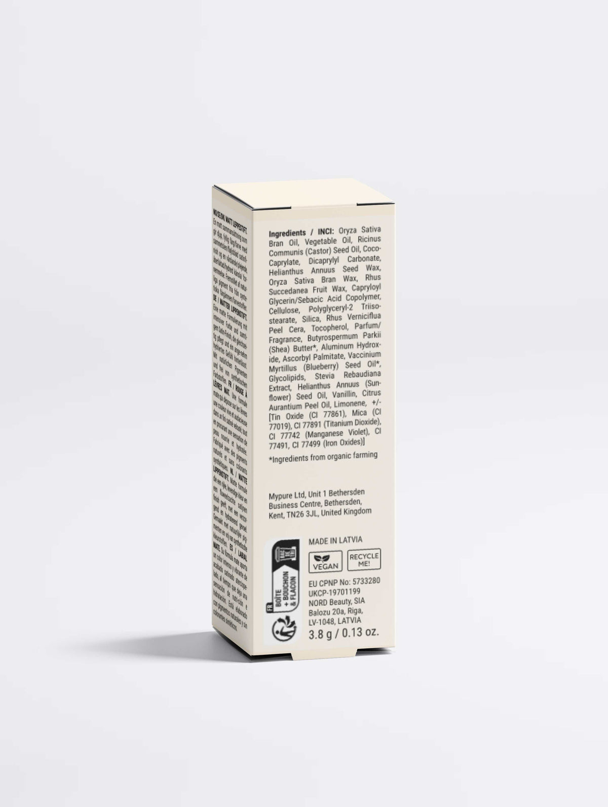Nourishing Matte Lipstick in a slim cream cardboard box with dense black ingredient text and vegan certification marks
