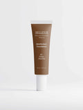 Peptide Skin-Perfecting Foundation in deep neutral brown, shown in a slim tube with a white cap and SkinPerfect label