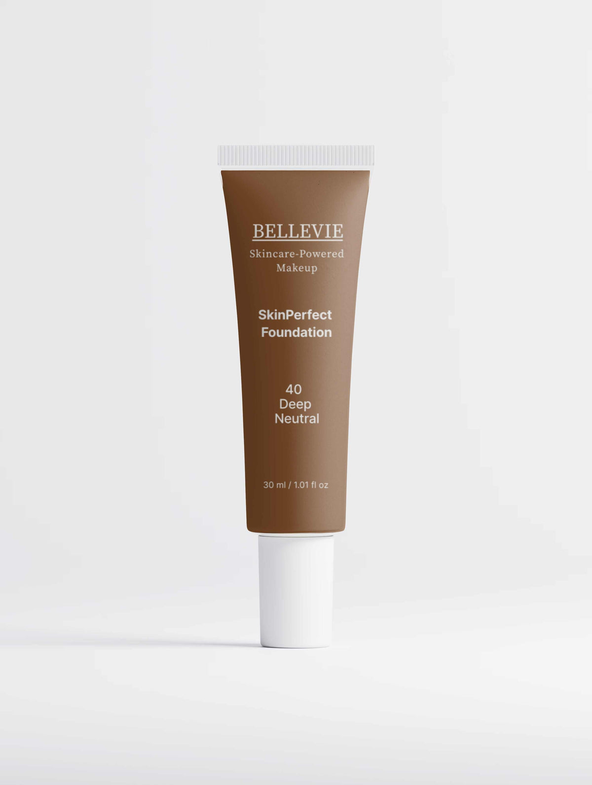 Peptide Skin-Perfecting Foundation in deep neutral brown, shown in a slim tube with a white cap and SkinPerfect label