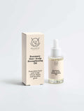 Rosemary Hair & Scalp Strengthening Oil in a clear glass dropper bottle with pale golden oil and cream packaging