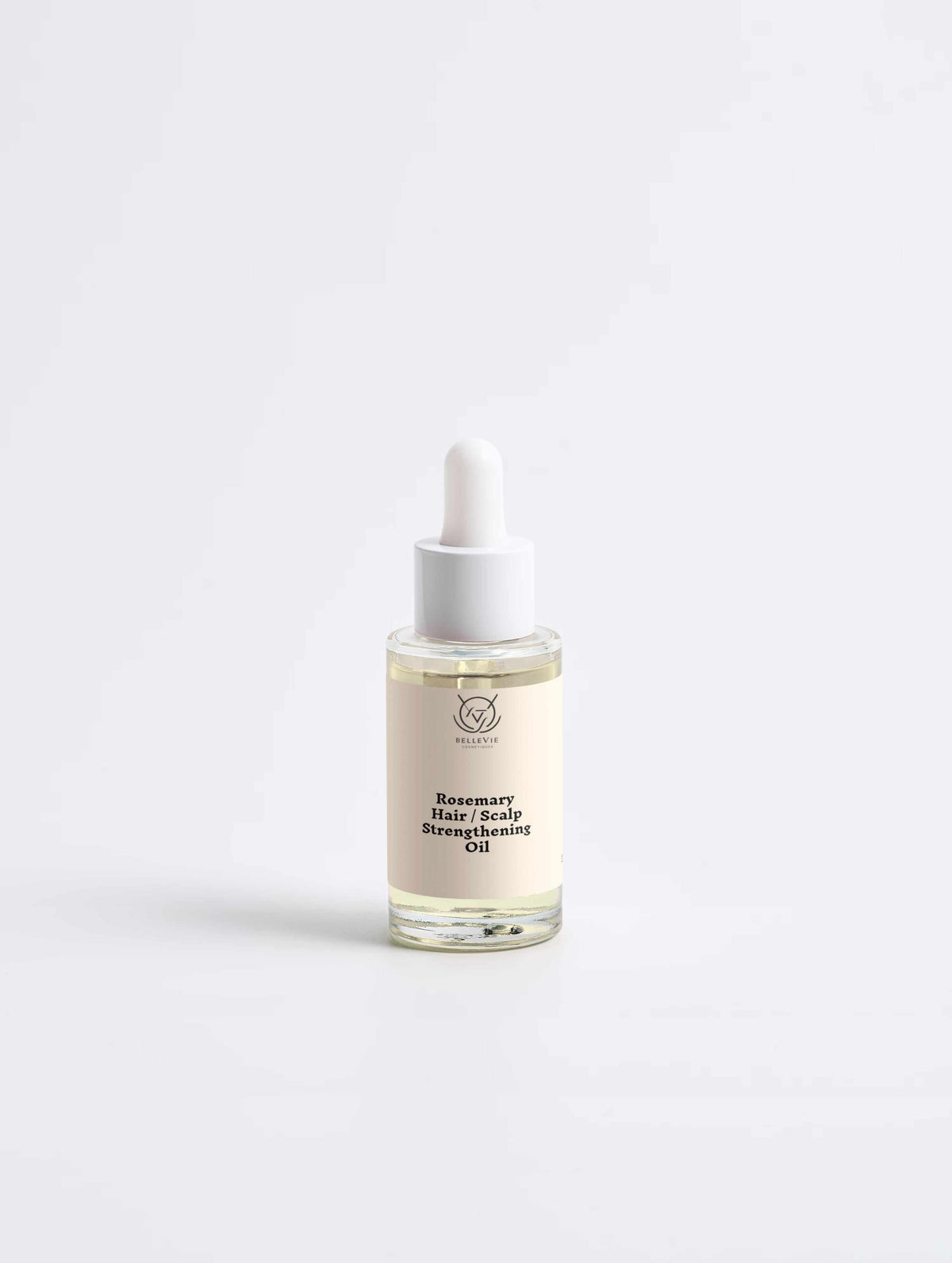 Rosemary Hair & Scalp Strengthening Oil in a clear glass dropper bottle with a white pipette and cream label