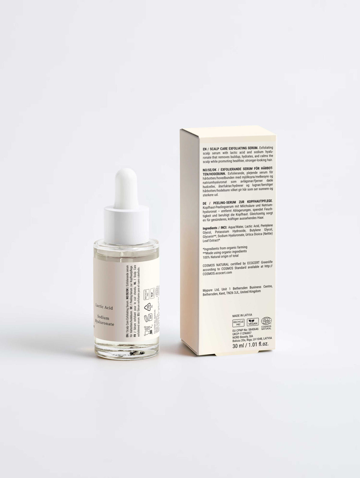 Scalp Renewal Exfoliating Serum in a clear glass dropper bottle with white pipette and matching cream carton