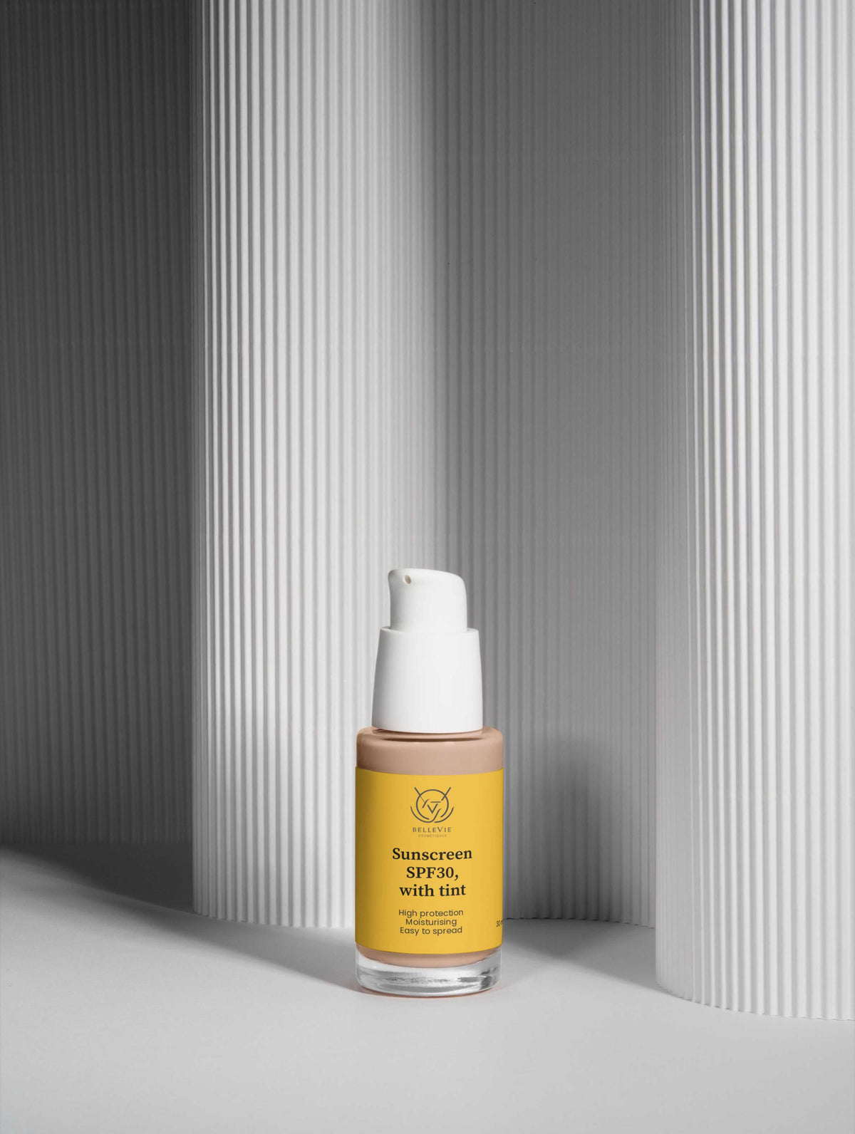 Tinted Mineral Sunscreen SPF 30 in a yellow-labeled bottle with a white pump and clear base