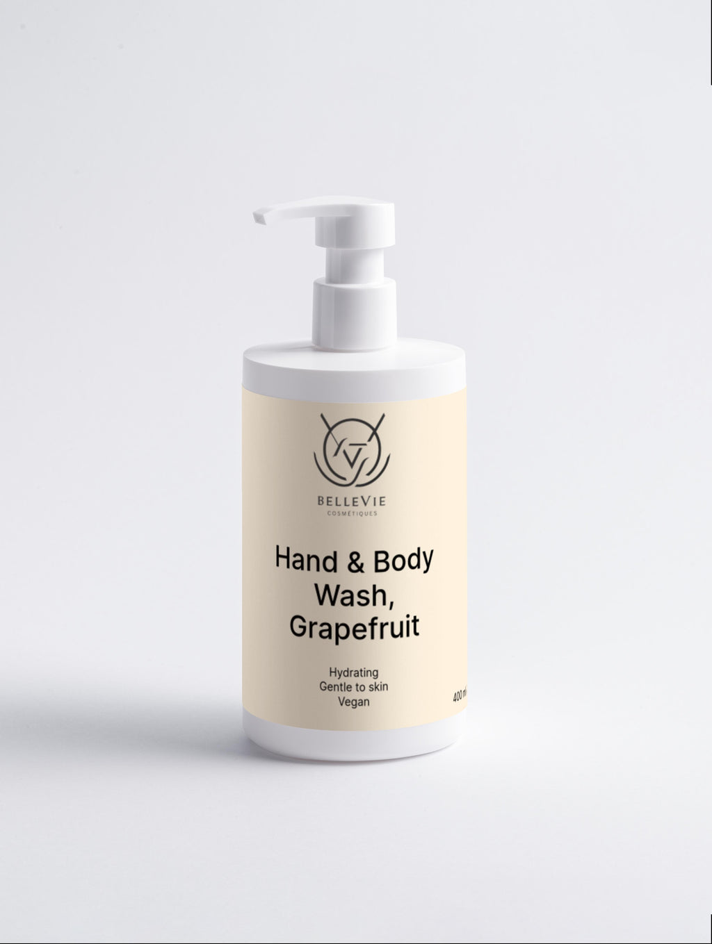 Hand and body wash bottle with grapefruit scent on a light gray background