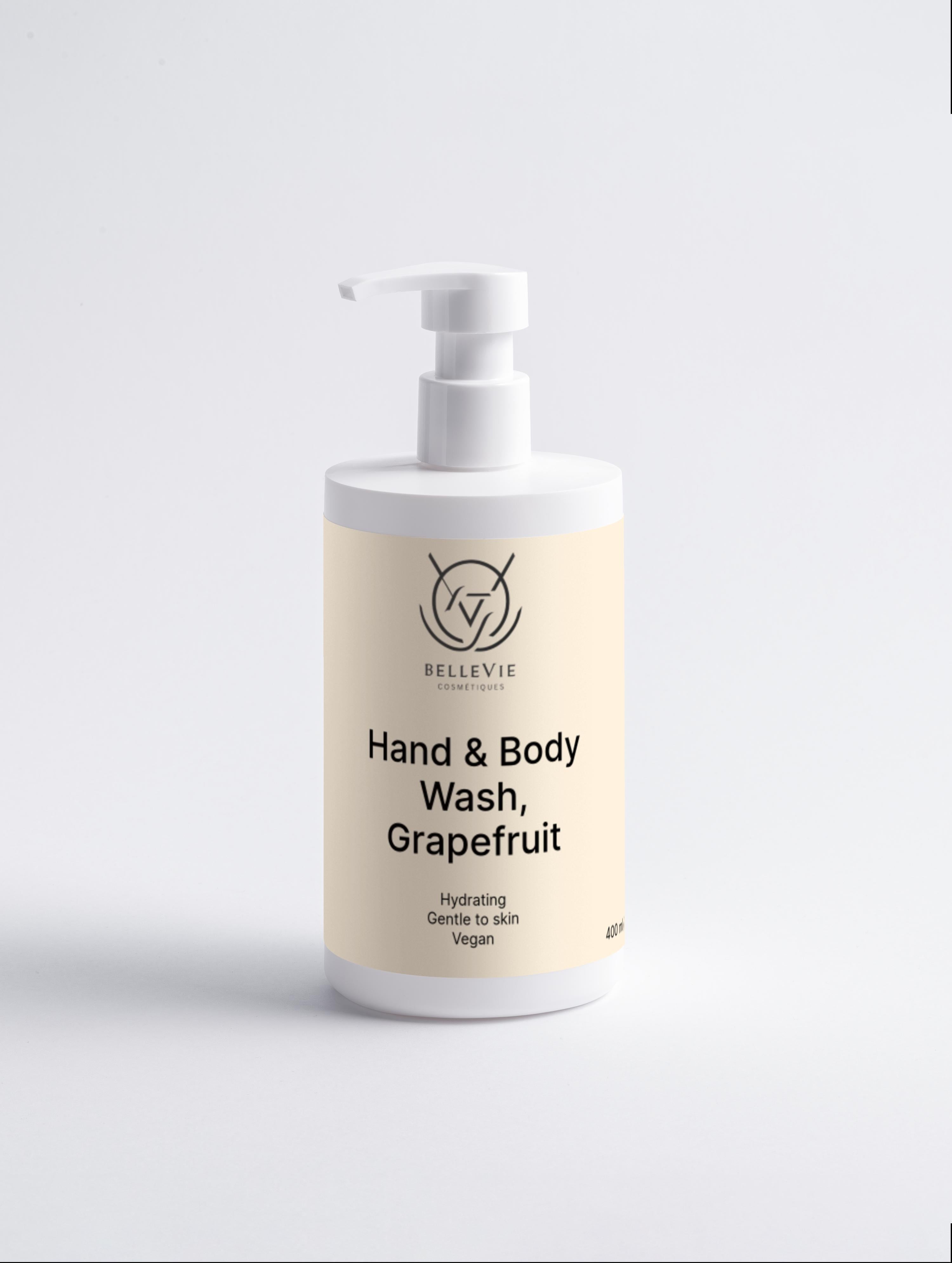 Hand and body wash bottle with grapefruit scent on a light gray background